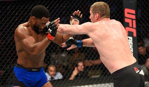 Rashad Evans (left) takes a hit from Dan Kelly