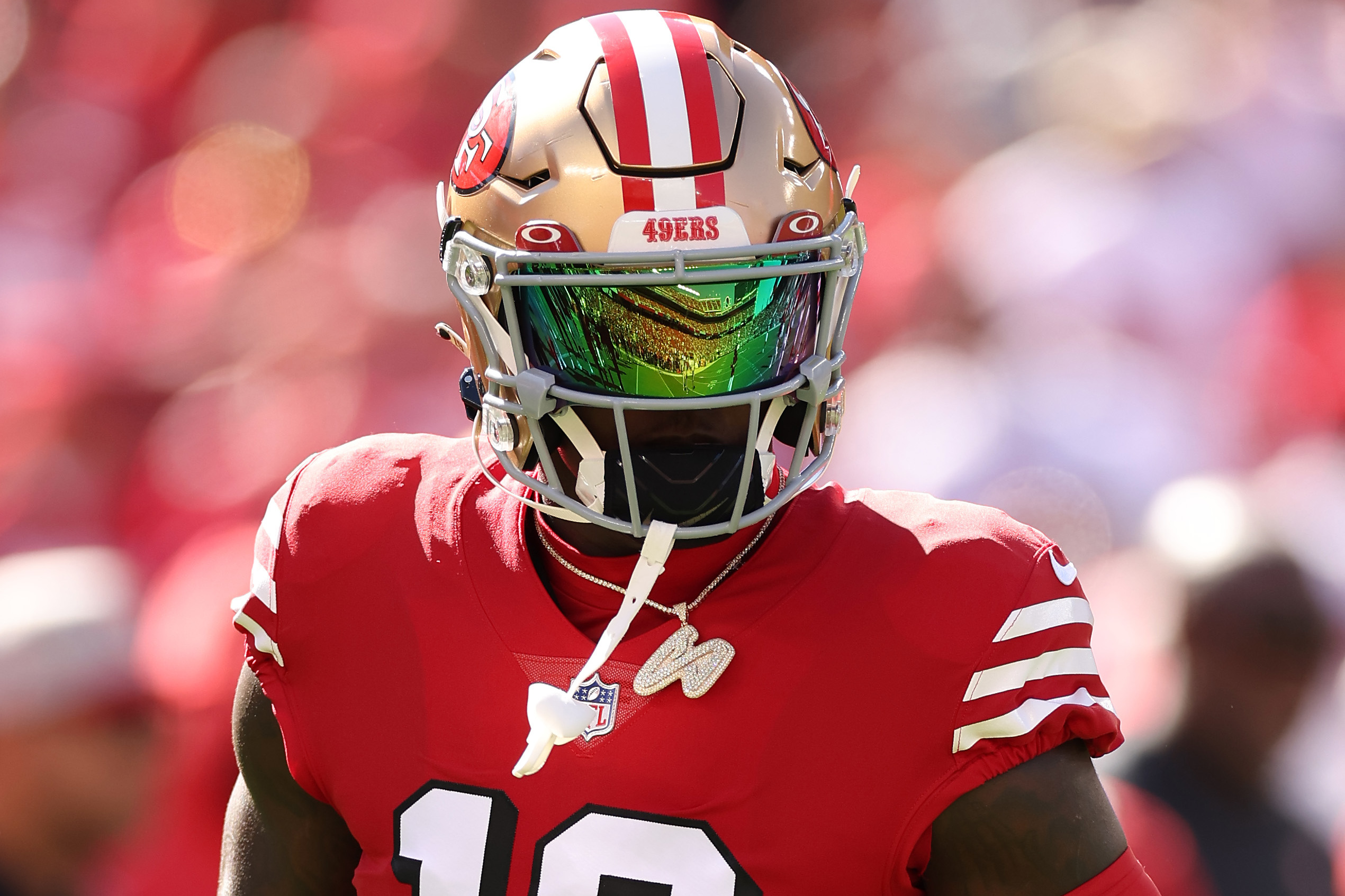 Picture of QB1 from first day of training camp. Rocking the red jersey and  even a visor on his helmet