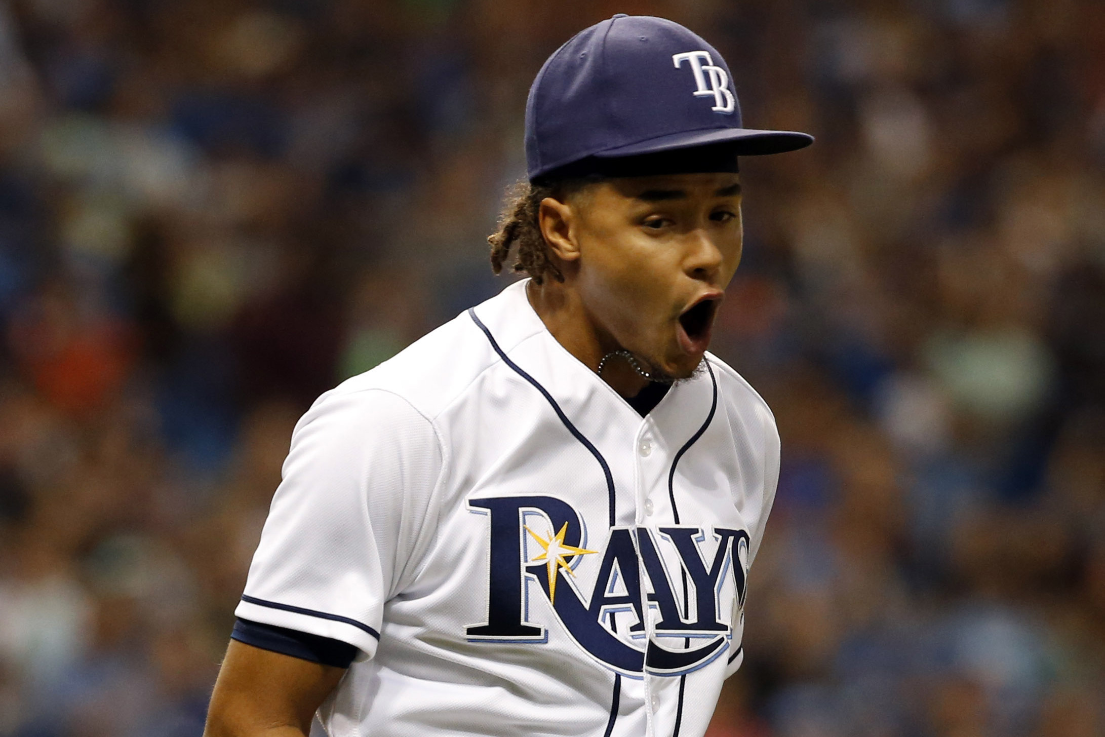 An American professional baseball player, Chris Archer holds a net