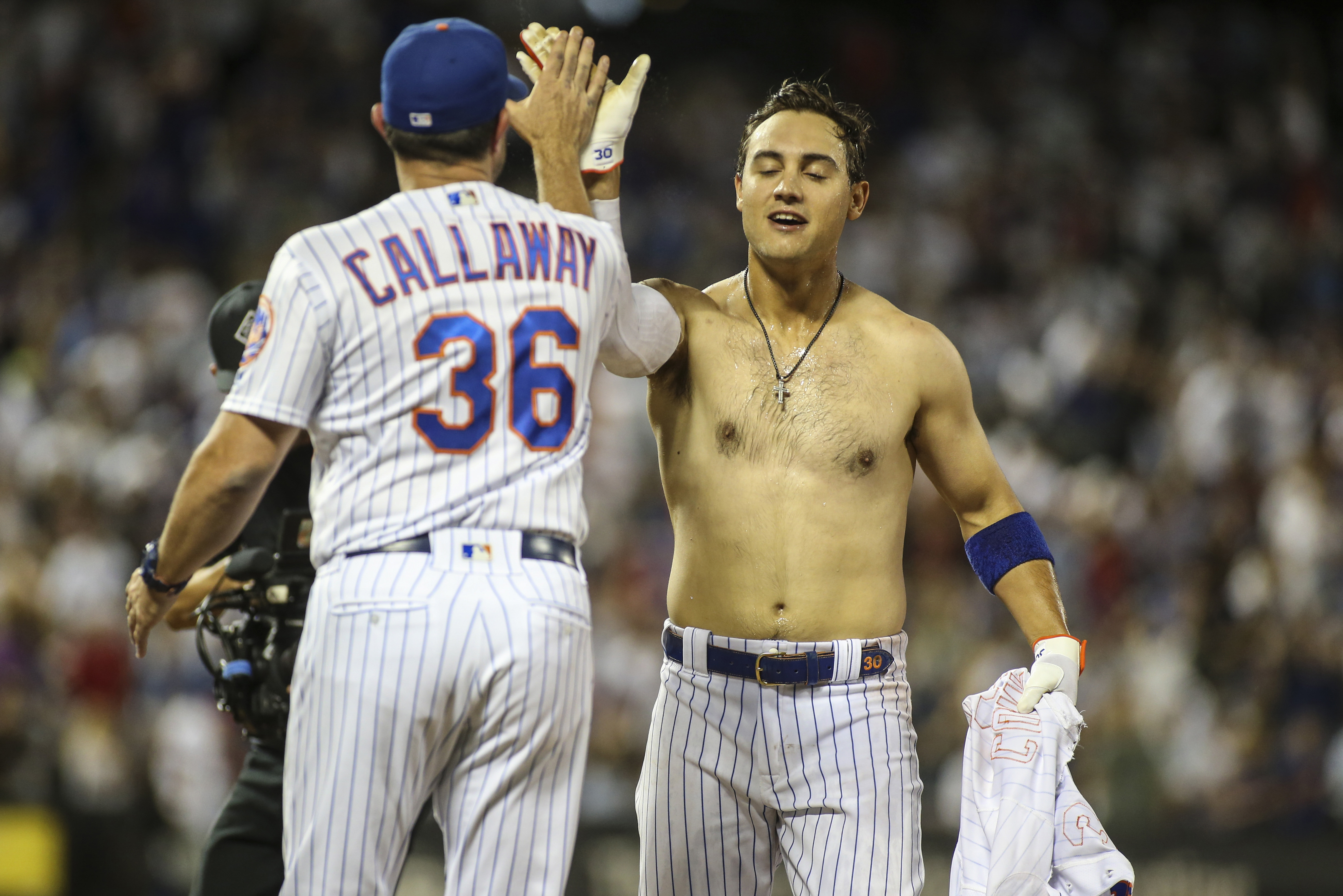 Conforto goes shirtless after Walk off win. 