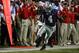 Sep 7, 2013; Manhattan, KS, USA; Kansas State Wildcats quarterback Daniel Sams (4) tries to stay in bounds during a 48-27 win against the Louisiana-Lafayette Ragin Cajuns at Bill Snyder Family Stadium. Mandatory Credit: Scott Sewell-USA TODAY Sports