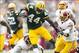 Sep 15, 2013; Green Bay, WI, USA; Green Bay Packers running back James Starks (44) rushes with the football as Washington Redskins cornerback David Amerson (39) defends during the third quarter at Lambeau Field. Green Bay won 38-20. Mandatory Credit: J