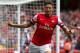 LONDON, ENGLAND - AUGUST 17: Olivier Giroud of Arsenal celebrates after scoring the opening goal during the Barclays Premier League match between Arsenal and Aston Villa at Emirates Stadium on August 17, 2013 in London, England. (Photo by Clive Mason/Ge