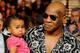 LAS VEGAS - JULY 31: Mike Tyson holds his daughter Milan as he arrives at the Juan Manuel Marquez and Juan Diaz bout at the Mandalay Bay Events Center July 31, 2010 in Las Vegas, Nevada. (Photo by Ethan Miller/Getty Images)