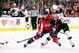 Sep 17, 2013; Baltimore, MD, USA; Washington Capitals forward Troy Brouwer (20) shoots the puck in front of Boston Bruins forward Justin Florek (57) at 1st Mariner Arena. Mandatory Credit: Evan Habeeb-USA TODAY Sports
