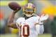 Sep 15, 2013; Green Bay, WI, USA; Washington Redskins quarterback Robert Griffin III (10) throws a pass during warmups prior to the game against the Green Bay Packers at Lambeau Field. Mandatory Credit: Jeff Hanisch-USA TODAY Sports