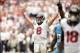 Sep 15, 2013; Houston, TX, USA; Houston Texans quarterback Matt Schaub (8) celebrates throwing the winning touchdown during overtime against the Tennessee Titans at Reliant Stadium. The Texans won 30-24. Mandatory Credit: Thomas Campbell-USA TODAY Sports