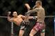 Sep 21, 2013; Toronto, Ontario, CAN; Renan Barao (left) throws a kick at Eddie Wineland during their interim bantamweight championship bout at UFC 165 at the Air Canada Centre. Mandatory Credit: Tom Szczerbowski-USA TODAY Sports