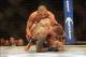 Sep 21, 2013; Toronto, Ontario, CAN; Renan Barao finishes off Eddie Wineland after connecting with a reverse kick during their interim bantamweight championship bout at UFC 165 at the Air Canada Centre. Mandatory Credit: Tom Szczerbowski-USA TODAY Sports