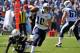NASHVILLE, TN - SEPTEMBER 22: Quarterback Jake Locker #10 of the Tennessee Titans scrambles against the San Diego Chargers at LP Field on September 22, 2013 in Nashville, Tennessee. (Photo by Frederick Breedon/Getty Images)