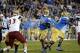Sep 21, 2013; Pasadena, CA, USA; UCLA Bruins quarterback Brett Hundley (17) throws a pass against the New Mexico State Aggies during the game at the Rose Bowl. Mandatory Credit: Richard Mackson-USA TODAY Sports