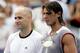 MONTREAL - AUGUST 14: Andre Agassi of the United States and Rafael Nadal of Spain pose for photographers after their match during the final of the Rogers Cup on August 14, 2005 at Uniprix Stadium in Montreal, Canada. Nadal defeated Agassi. (Photo by Matth