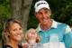 PONTE VEDRA BEACH, FL - MAY 10: Henrik Stenson of Sweden poses with his wife Emma and daughter Lisa while holding the trophy after his four stroke victory during the final round of THE PLAYERS Championship on THE PLAYERS Stadium Course at TPC Sawgrass on