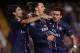 VALENCIA, SPAIN - FEBRUARY 12: Ezequiel Lavezzi (R) of Paris Saint-Germain celebrates scoring with his team-mate Zlatan Ibrahimovic and Javier Pastore (L) during the UEFA Champions League Round of 16 first leg match between Valencia CF and Paris St Germa