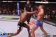 Gustafsson attempts a long uppercut with his hands low and eats a right straight instead.