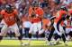 DENVER, CO - SEPTEMBER 30: Quarterback Peyton Manning #18 of the Denver Broncos drops back to pass against the Oakland Raiders at Sports Authority Field at Mile High on September 30, 2012 in Denver, Colorado. The Broncos defeated the Raiders 37-6. (Phot