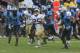 ATLANTA, GA - SEPTEMBER 21: Running back Robert Godhigh #25 of the Georgia Tech Yellow Jackets is pursued by members of the North Carolina Tar Heels defense during the game at Bobby Dodd Stadium at Historic Grant Field on September 21, 2013 in Atlanta, G