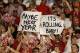 Jan 7, 2013; Miami, FL, USA; Alabama Crimson Tide fans hold up signs during the game against the Notre Dame Fighting Irish during the 2013 BCS Championship game at Sun Life Stadium. Alabama won 42-14. Mandatory Credit: Matthew Emmons-USA TODAY Sports
