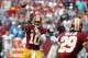Sep 22, 2013; Landover, MD, USA; Washington Redskins quarterback Robert Griffin III (10) throws the ball to Redskins running back Roy Helu (29) against the Detroit Lions in the fourth quarter at FedEx Field. The Lions won 27-20. Mandatory Credit: Geoff Bu