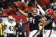 ATLANTA, GA - NOVEMBER 29: Corey Peters #91 and Jonathan Babineaux #95 of the Atlanta Falcons celebrates after Peters intercepted a pass by Drew Brees #9 of the New Orleans Saints that was overturned on a Falcons offsides penalty at Georgia Dome on Novem