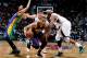 ATLANTA, GA - FEBRUARY 08: Eric Gordon #10 of the New Orleans Hornets drives past Josh Smith #5 of the Atlanta Hawks at Philips Arena on February 8, 2013 in Atlanta, Georgia. NOTE TO USER: User expressly acknowledges and agrees that, by downloading and