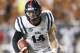 AUSTIN, TX - SEPTEMBER 14: Bo Wallace #14 of the Mississippi Rebels scrambles against the Texas Longhorns on September 14, 2013 at Darrell K Royal-Texas Memorial Stadium in Austin, Texas. (Photo by Cooper Neill/Getty Images)