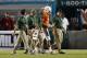 MIAMI GARDENS, FL - SEPTEMBER 21: Stephen Morris #17 of the Miami Hurricanes is helped off the field after being injured during first quarter action against the Savannah State Tigers on September 21, 2013 at Sun Life Stadium in Miami Gardens, Florida. Mia