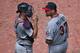 TORONTO, CANADA - JULY 6: Mike Pelfrey #37 of the Minnesota Twins talks to Joe Mauer #7 during MLB game action against the Toronto Blue Jays on July 6, 2013 at Rogers Centre in Toronto, Ontario, Canada. (Photo by Tom Szczerbowski/Getty Images)