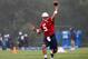 FOXBORO, MA - JULY 26: Tim Tebow #5 throws during the first day of New England Patriots Training Camp at Gillette Stadium on July 26, 2013 in Foxboro, Massachusetts. (Photo by Jim Rogash/Getty Images)