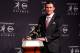 NEW YORK, NY - DECEMBER 08: Quarterback Johnny Manziel of the Texas A&M University Aggies poses with the Heisman Memorial Trophy after being named the 78th Heisman Memorial Trophy Award winner at a press conference after at the Marriott Marquis on Decemb