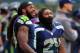 SEATTLE, WA - SEPTEMBER 22: Wide receiver Sidney Rice #18 of the Seattle Seahawks and running back Marshawn Lynch #24 of the Seattle Seahawks watch from the sidelines as the clock winds down during the fourth quarter of the game against the Jacksonville J