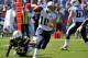 NASHVILLE, TN - SEPTEMBER 22: Quarterback Jake Locker #10 of the Tennessee Titans scrambles against the San Diego Chargers at LP Field on September 22, 2013 in Nashville, Tennessee. (Photo by Frederick Breedon/Getty Images)