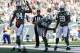 EAST RUTHERFORD, NJ - SEPTEMBER 22: Quarterback Geno Smith #7 of the New York Jets spikes the ball in the end zone after an eight yard run for a touchdown as teammates wide receiver Stephen Hill #84 and running back Bilal Powell #29 look on in the first q