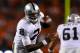 DENVER, CO - SEPTEMBER 23: Quarterback Terrelle Pryor #2 of the Oakland Raiders watches as the ball is snapped over his head during the third quarter against the Denver Broncos at Sports Authority Field Field at Mile High on September 23, 2013 in Denver,