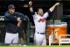 CLEVELAND, OH - SEPTEMBER 20: Yan Gomes #10 and Jason Kipnis #22 of the Cleveland Indians cheer on their teammates from the dugout during the seventh inning against the Houston Astros at Progressive Field on September 20, 2013 in Cleveland, Ohio. (Photo