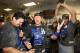 PHOENIX, AZ - SEPTEMBER 19: (L-R) Adrian Gonzalez #23, A.J. Ellis #17 and pitcher Clayton Kershaw #22 of the Los Angeles Dodgers celebrate in the locker room after defeating the Arizona Diamondbacks to clinch the National League West title and a postsea