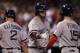 DENVER, CO - SEPTEMBER 25: Jarrod Saltalamacchia #39 of the Boston Red Sox welcomes Jacoby Ellsbury #2 of the Boston Red Sox and Dustin Pedroia #15 of the Boston Red Sox home as they scored on a double by David Ortiz #34 of the Boston Red Sox off of star