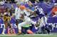 MINNEAPOLIS, MN - SEPTEMBER 22: Jordan Cameron #84 of the Cleveland Browns scores a touchdown as Jamarca Sanford #33 of the Minnesota Vikings attempts to push Cameron out of bounds before crossing the goal line during the second quarter of the game on Sep