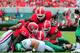 ATHENS, GA - SEPTEMBER 21: Brandin Byrd #24 and Mason Y'Barbo #57 of the North Texas Mean Green are buried by Chris Mayes #93, Amarlo Harrera #52, and Josh Harvey-Clemons #25 of the Georgia Bulldogs at Sanford Stadium on September 21, 2013 in Athens, Geor