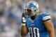 DETROIT, MI - NOVEMBER 22: Ndamukong Suh #90 of the Detroit Lions adjusts his face mask while playing the Houston Texans at Ford Field on November 22, 2012 in Detroit, Michigan. Houston won the game 34-31. (Photo by Gregory Shamus/Getty Images)
