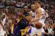 Kobe Bryant dishes off after a drive.