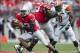 Sep 21, 2013; Columbus, OH, USA; Ohio State Buckeyes quarterback Kenny Guiton (13) scrambles for open field against the Florida A&M Rattlers at Ohio Stadium. Ohio State won the game 76-0. Mandatory Credit: Greg Bartram-USA TODAY Sports