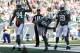 EAST RUTHERFORD, NJ - SEPTEMBER 22: Quarterback Geno Smith #7 of the New York Jets spikes the ball in the end zone after an eight yard run for a touchdown as teammates wide receiver Stephen Hill #84 and running back Bilal Powell #29 look on in the first q