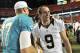 Aug 29, 2013; Miami Gardens, FL, USA; New Orleans Saints quarterback Drew Brees (right) shakes hands with Miami Dolphins quarterback Ryan Tannehill (17) after their game at Sun Life Stadium. Mandatory Credit: Steve Mitchell-USA TODAY Sports
