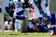 CHARLOTTE, NC - SEPTEMBER 22: Eli Manning #10 of the New York Giants is knocked to the ground during their game against the Carolina Panthers at Bank of America Stadium on September 22, 2013 in Charlotte, North Carolina. (Photo by Streeter Lecka/Getty