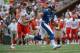 January 27, 2013; Honolulu, HI, USA; NFC quarterback Russell Wilson of the Seattle Seahawks (3) runs past AFC defensive end J.J. Watt of the Houston Texans (99) in the third quarter during the 2013 Pro Bowl at Aloha Stadium. The NFC defeated the AFC 62-35
