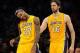 November 9, 2012; Los Angeles, CA, USA; Los Angeles Lakers power forward Pau Gasol (16) looks on as center Jordan Hill (27) stretches his neck after he was fouled in the first half of the game at the Staples Center. Mandatory Credit: Jayne Kamin-Oncea-U