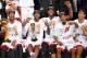 Heat players pose after winning their second straight NBA title.