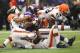 MINNEAPOLIS, MN - SEPTEMBER 22: Adrian Peterson #28 of the Minnesota Vikings gets tackled by Buster Skrine #22, Barkevious Mingo #51 and T.J. Ward #43 of the Cleveland Browns on September 22, 2013 at Mall of America Field at the Hubert Humphrey Metrodome