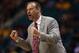 LAS VEGAS, NV - MARCH 13: Utah Utes head coach Larry Krystkowiak cheers his team on in the second half against the USC Trojans during the first round of the Pac 12 Tournament at the MGM Grand Garden Arena on March 13, 2013 in Las Vegas, Nevada. Utah defe